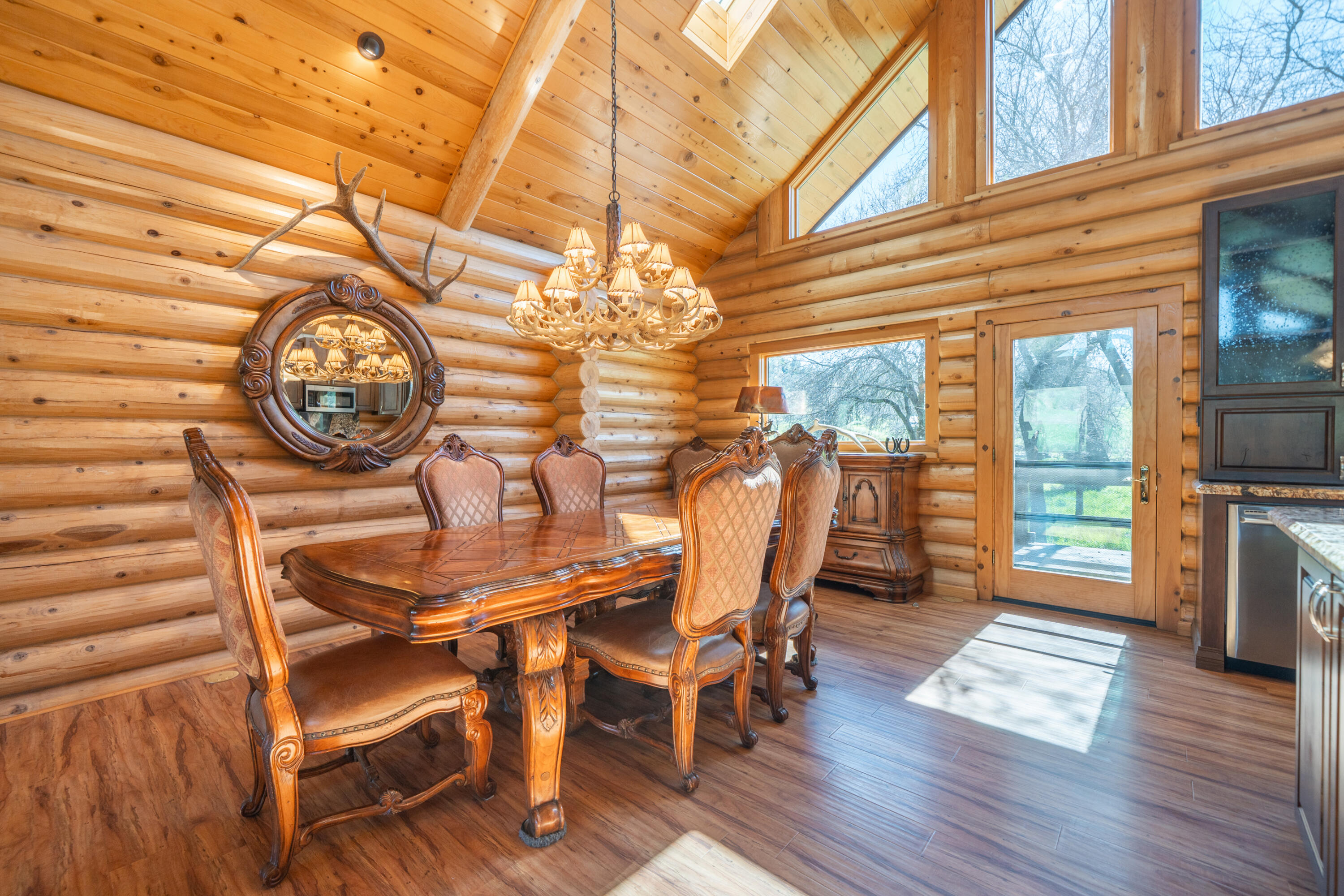 11875 Oak Run Road Oak Run, CA 96069 - Photo 10 of 127 a view of a dining room with furniture window and wooden floor