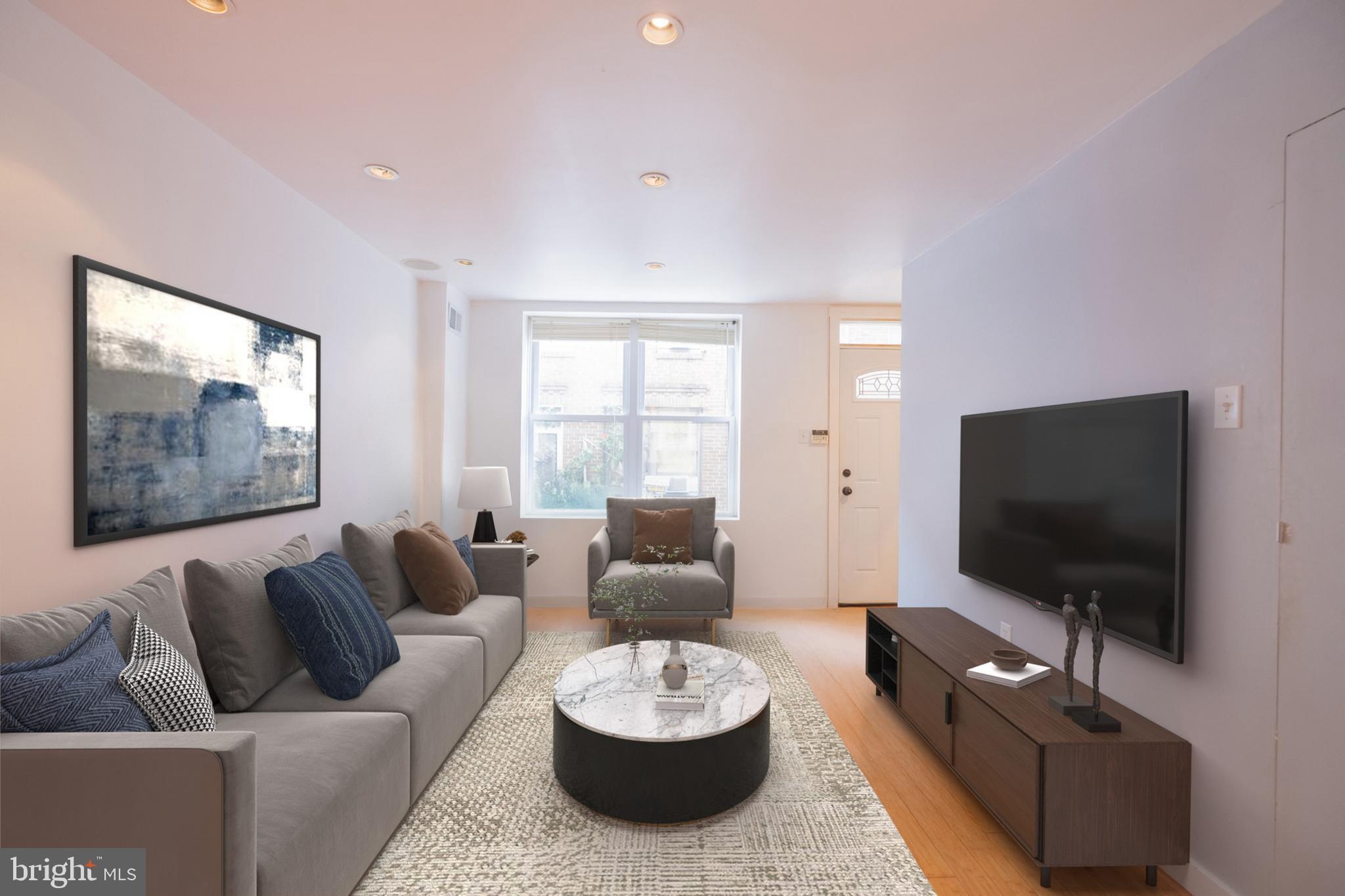 930 League Street Philadelphia, PA 19147 - Photo 3 of 29 a living room with furniture and a flat screen tv
