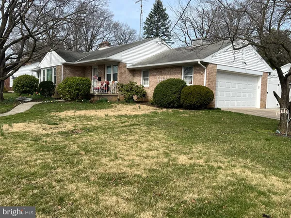 a view of house with yard