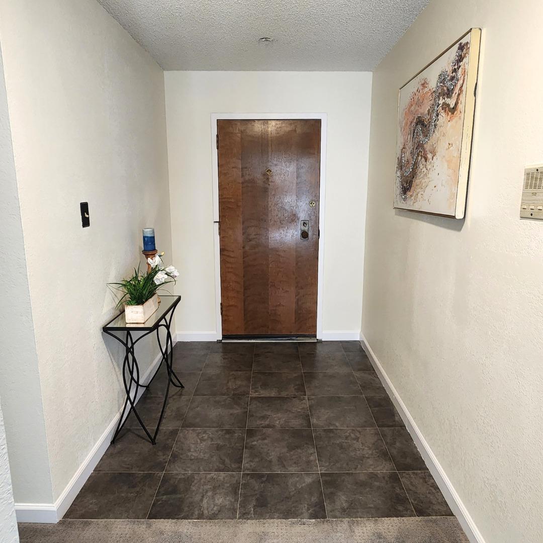 1500 Broadway, Unit 205 Burlingame, CA 94010 - Photo 11 of 24 a view of a livingroom with a table and chair