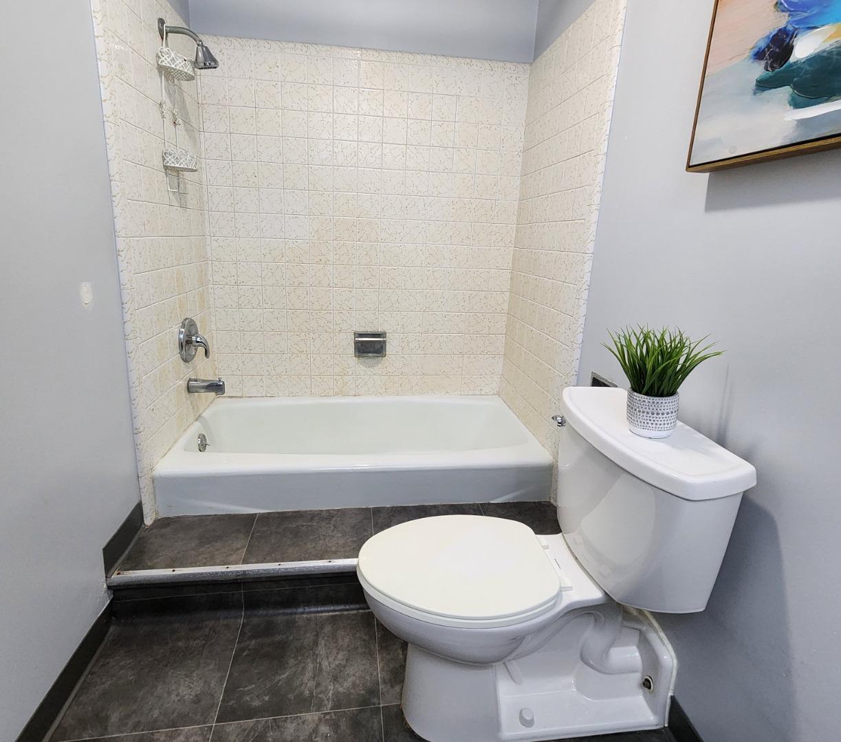 1500 Broadway, Unit 205 Burlingame, CA 94010 - Photo 14 of 24 a bathroom with a toilet and a bathtub
