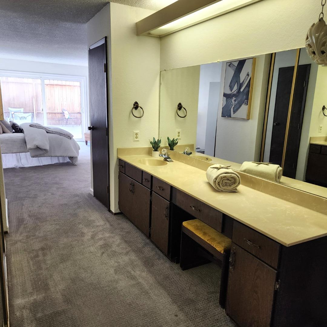 1500 Broadway, Unit 205 Burlingame, CA 94010 - Photo 17 of 24 a bathroom with a sink double vanity and a mirror