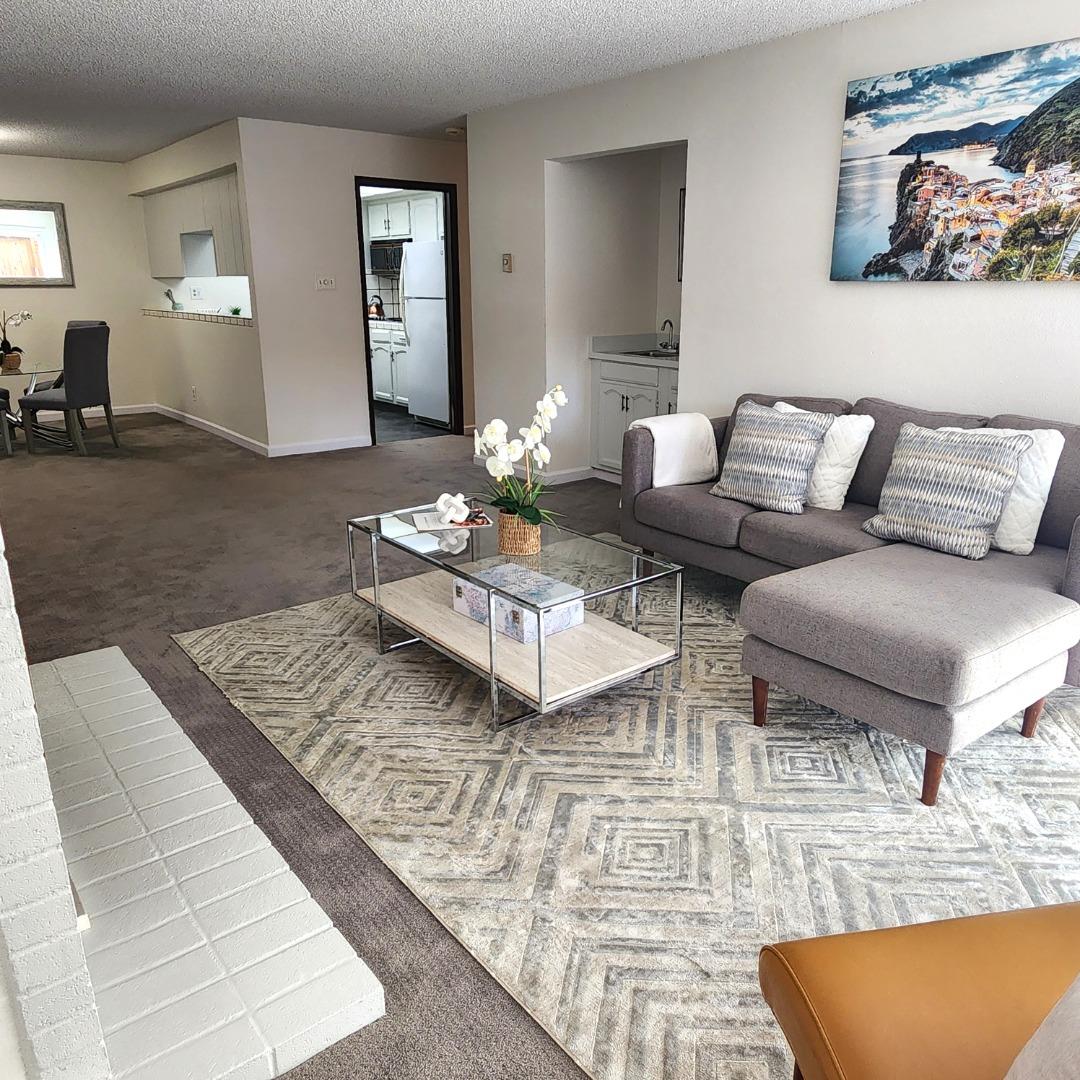 1500 Broadway, Unit 205 Burlingame, CA 94010 - Photo 2 of 24 a living room with furniture and wooden floor