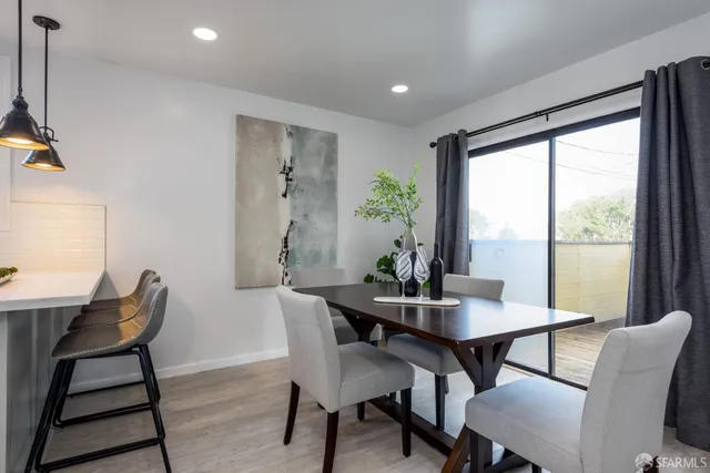 a view of a dining room with furniture window and outside view