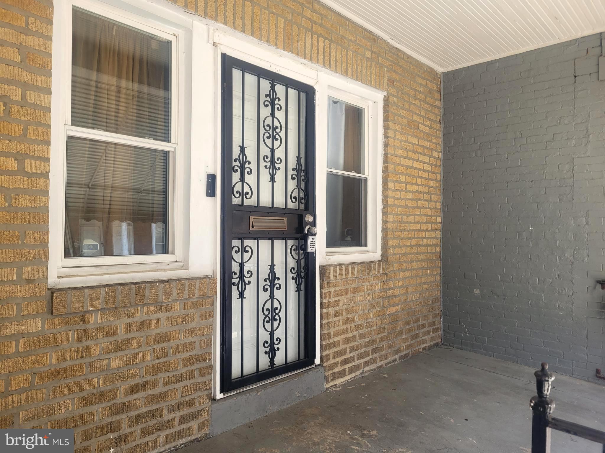 5563 Blakemore Street Philadelphia, PA 19138 - Photo 13 of 14 a front view of a house with front door