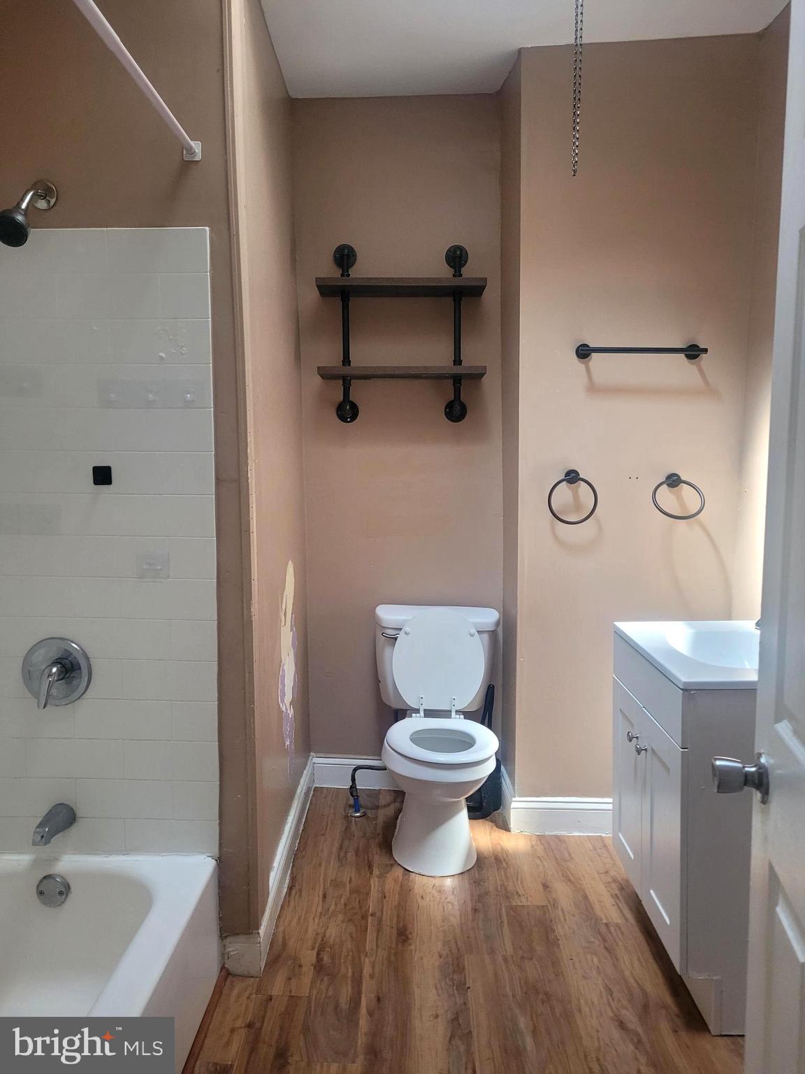 5563 Blakemore Street Philadelphia, PA 19138 - Photo 7 of 14 a bathroom with a toilet and a shower