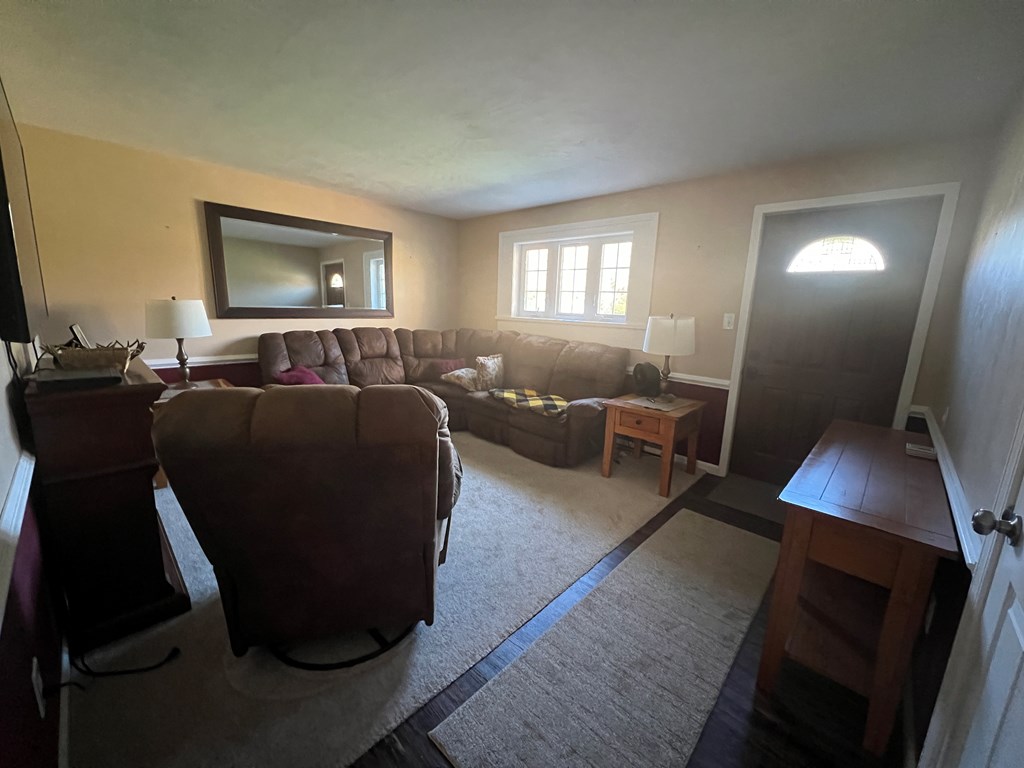 3958 Georgetown Road Polk, PA 16342 - Photo 11 of 20 a living room with furniture a flat screen tv and a window