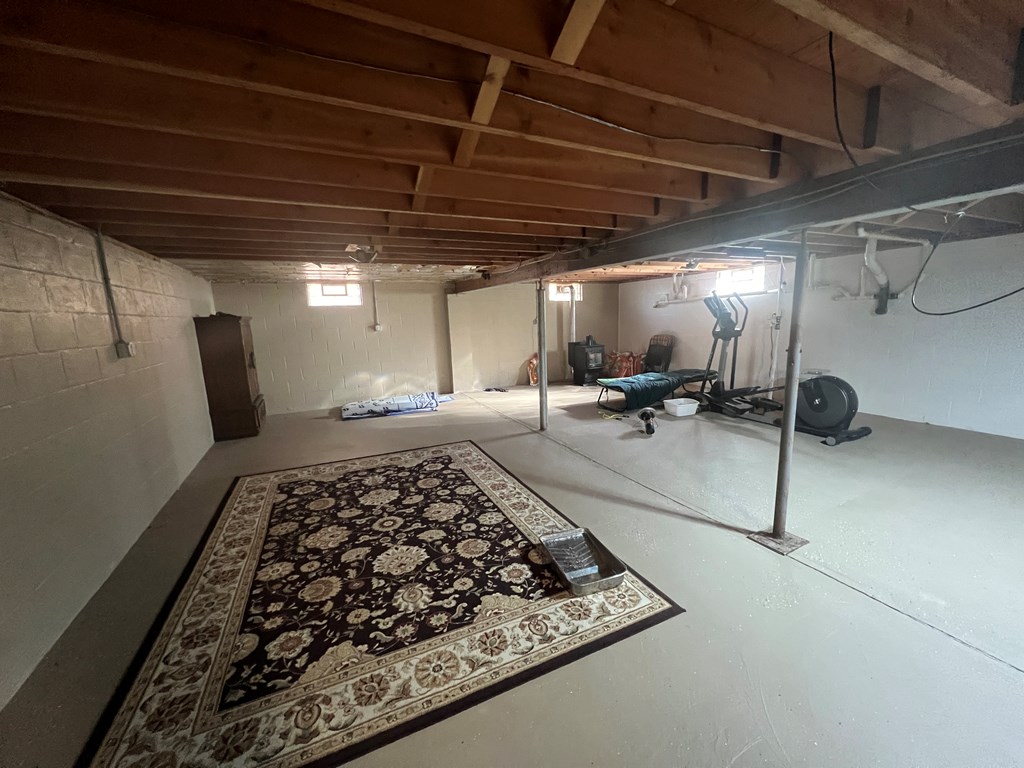 3958 Georgetown Road Polk, PA 16342 - Photo 17 of 20 a large room with a rug