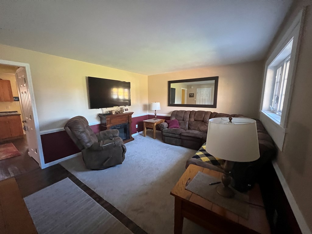 3958 Georgetown Road Polk, PA 16342 - Photo 10 of 20 a living room with furniture and a flat screen tv