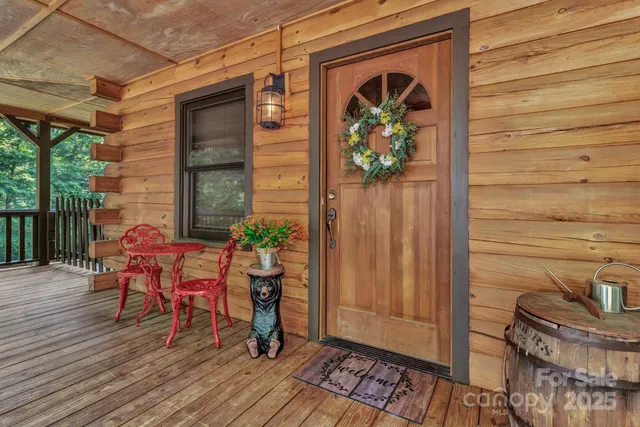 a view of a porch with furniture and wooden floor