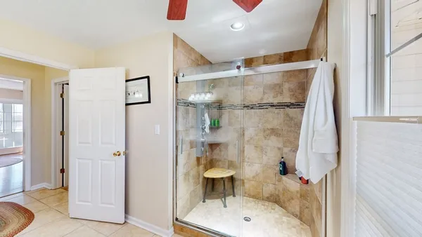 a bathroom with a shower and a sink