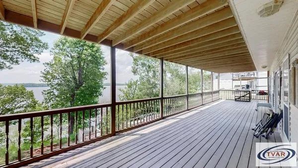 a view of porch with wooden floor