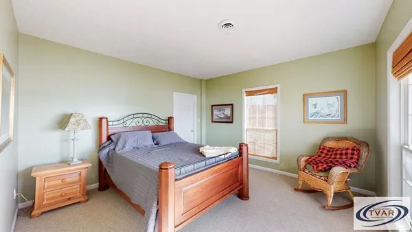 a bed room with a bed and a couch
