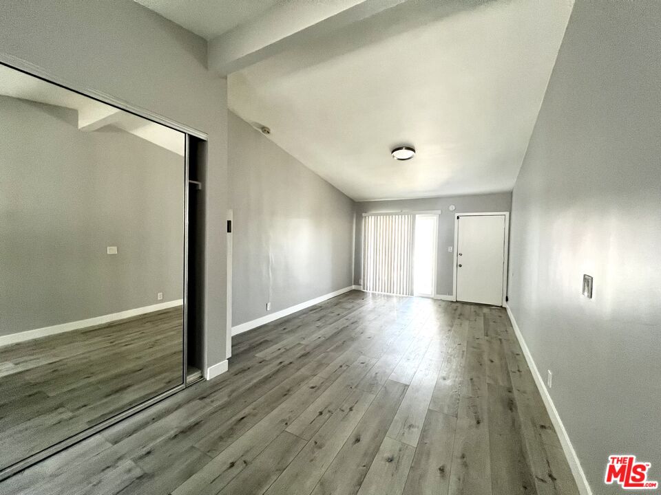 4025 Palmyra Road, Unit 1 Los Angeles, CA 90008 - Photo 4 of 5 a view of an empty room with wooden floor