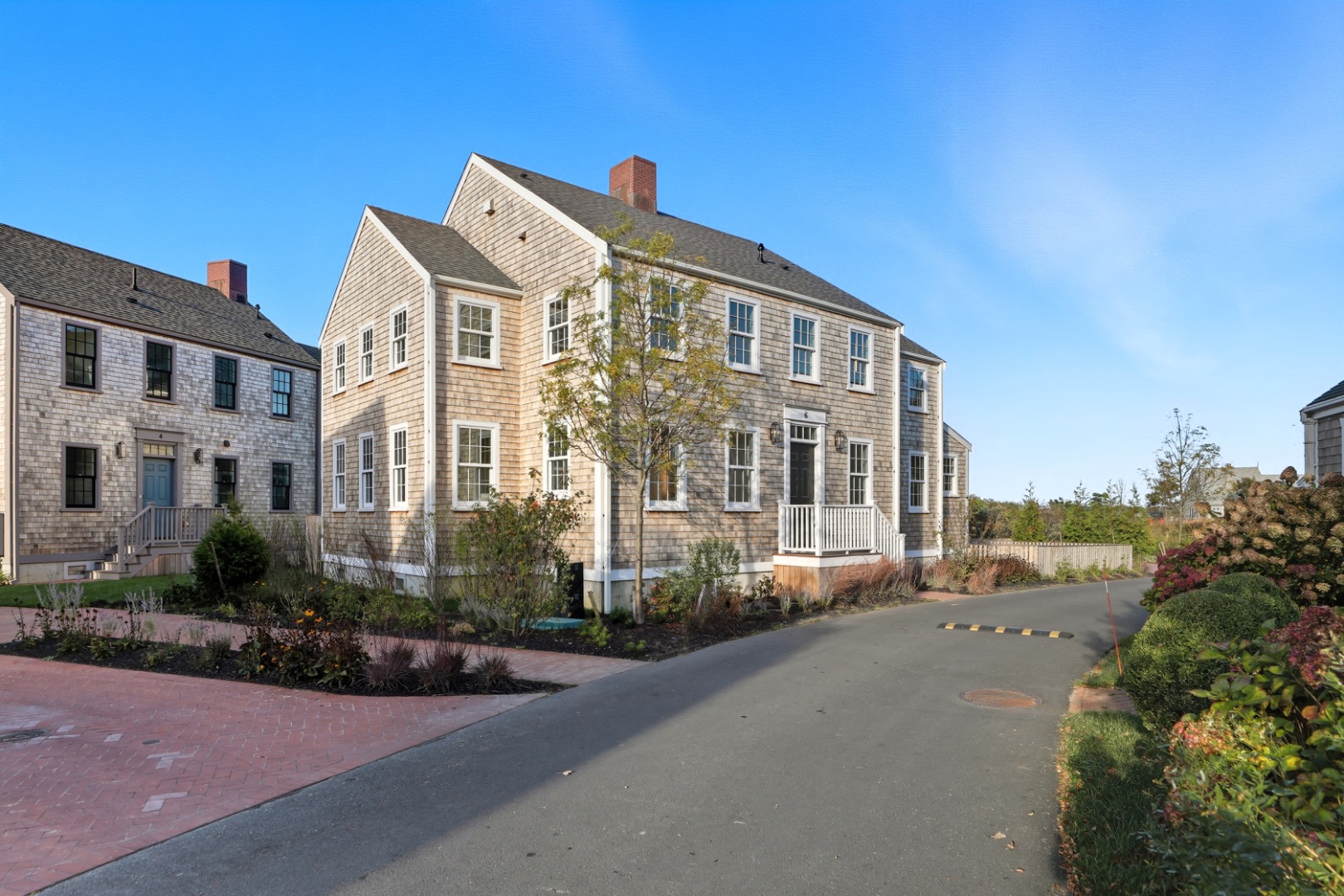 6 Mariner Way Nantucket, MA 02554 - Photo 3 of 31 a front view of a building with a garden