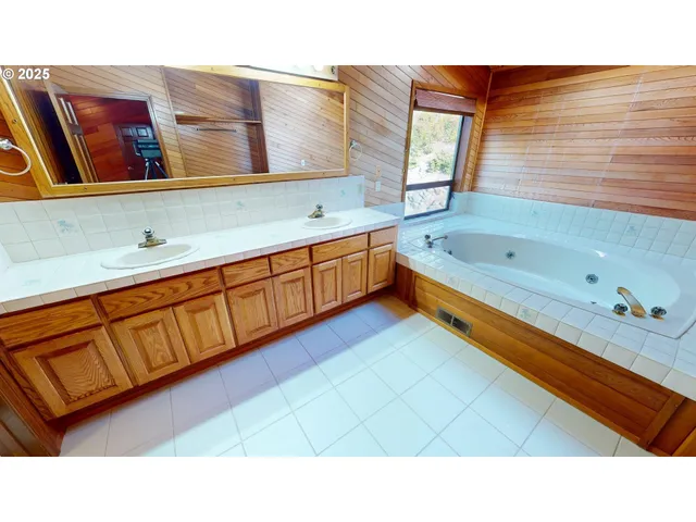 a bathroom with a glass shower door