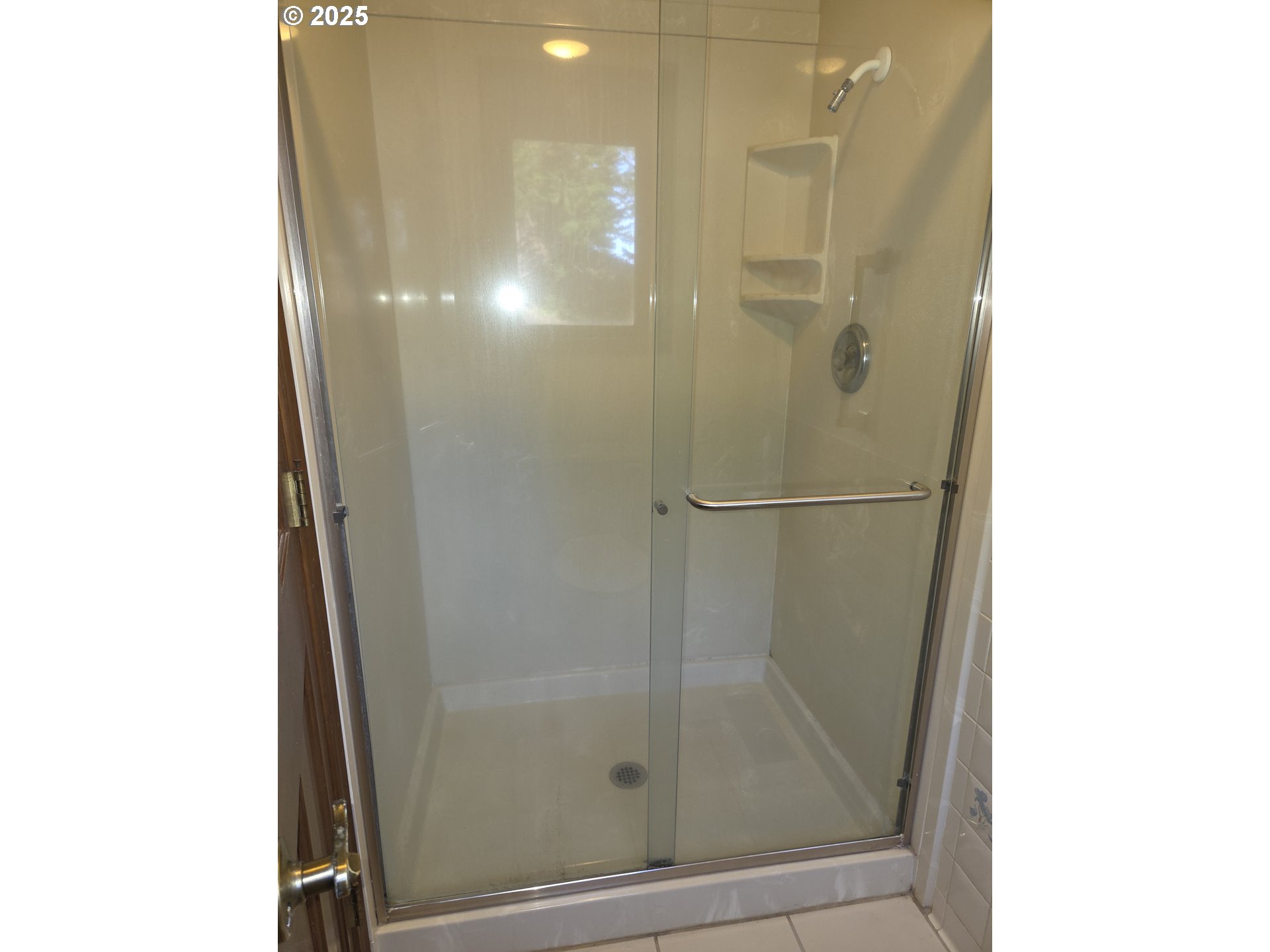 95107 Welsh Drive Gold Beach, OR 97444 - Photo 20 of 48 a bathroom with a glass shower door