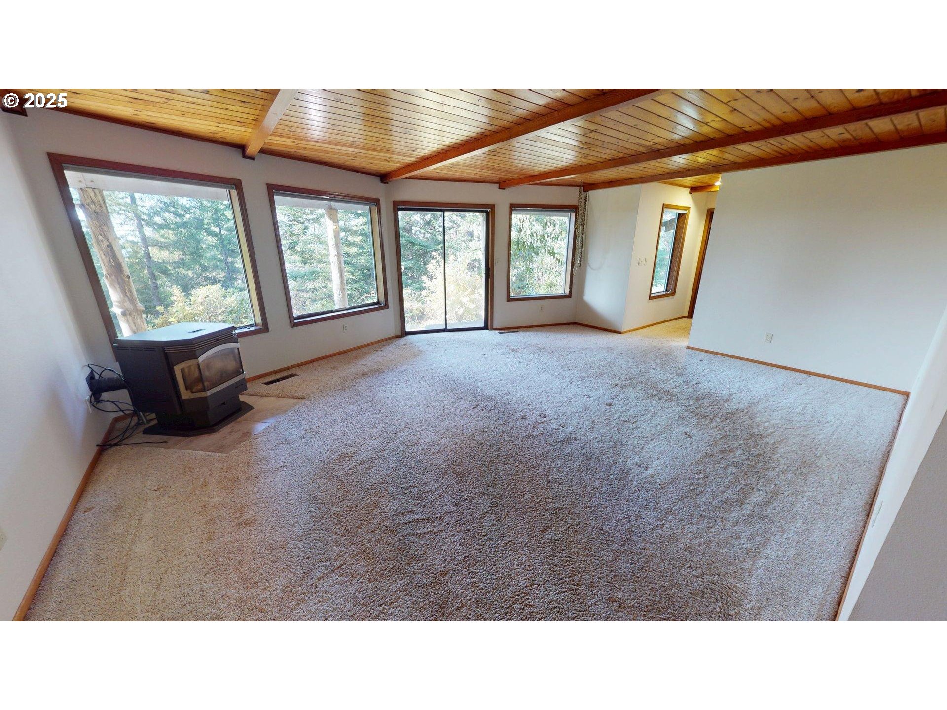95107 Welsh Drive Gold Beach, OR 97444 - Photo 27 of 48 a room with large windows and stairs