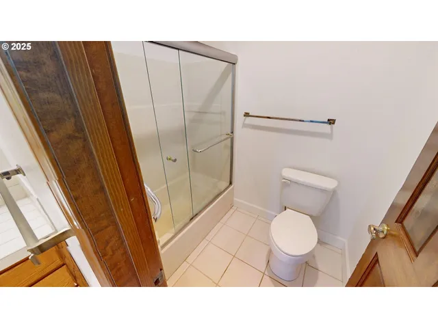 a bathroom with sink a mirror and a toilet