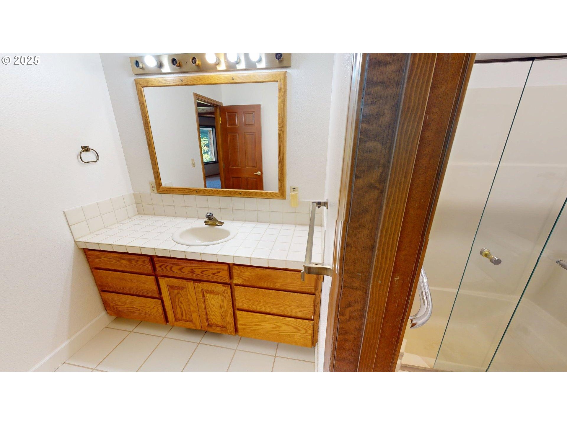 95107 Welsh Drive Gold Beach, OR 97444 - Photo 30 of 48 a bathroom with sink and mirror