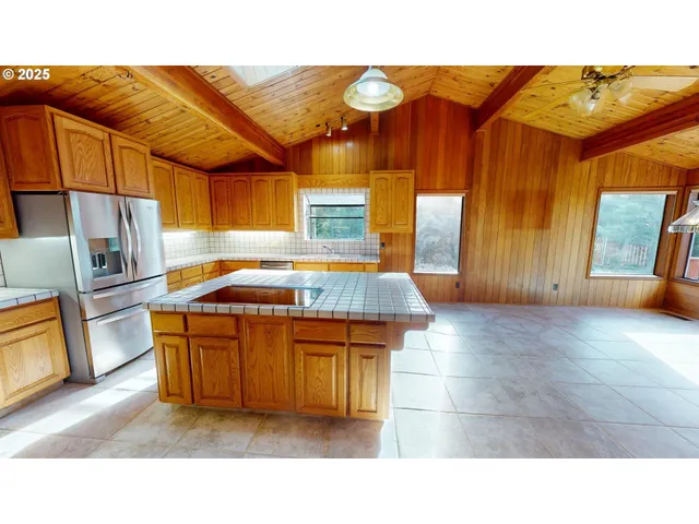 a kitchen with a sink and wooden cabinets