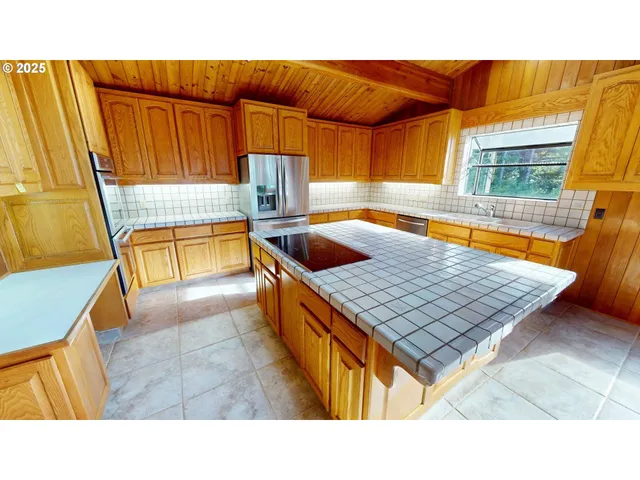a kitchen with a sink and a stove