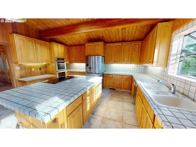 a room with pool table and windows