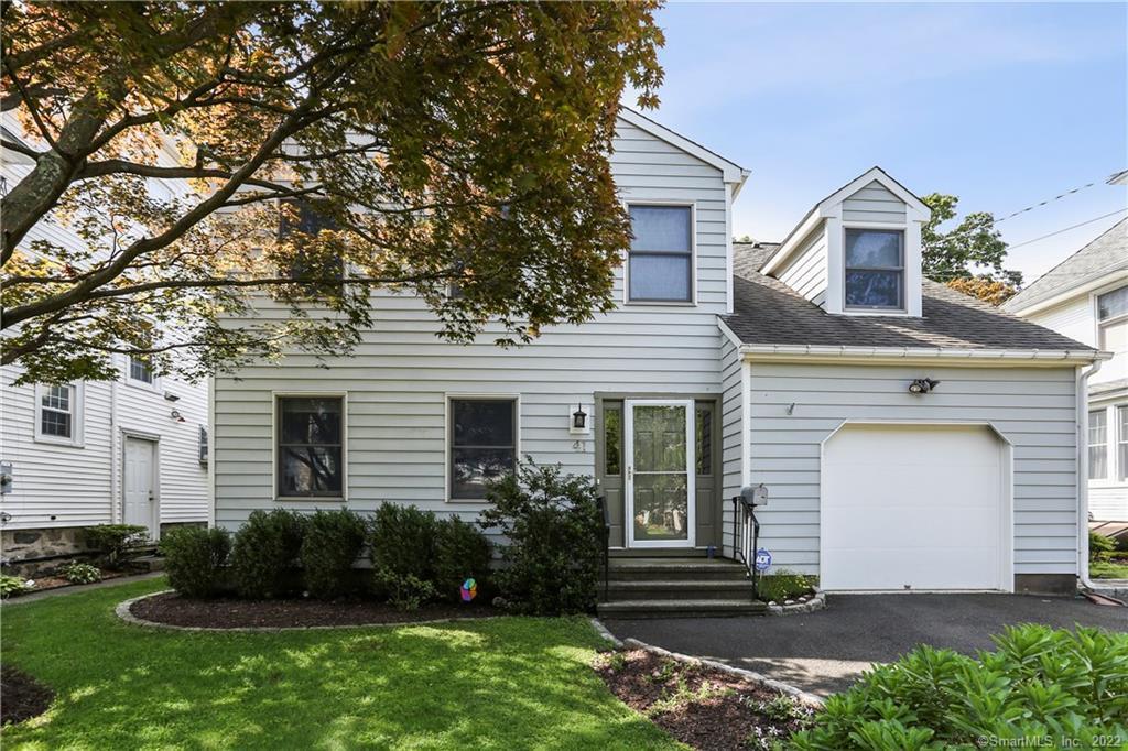 41 Auldwood Road Stamford, CT 06902 - Photo 1 of 1 a front view of a house with garden