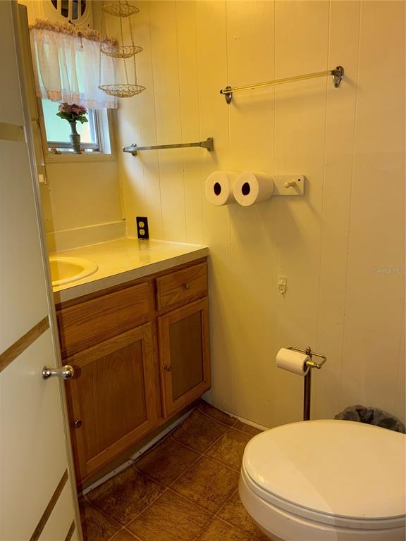 24533 Pink Panther Road Paisley, FL 32767 - Photo 16 of 29 a bathroom with a sink a toilet and shower