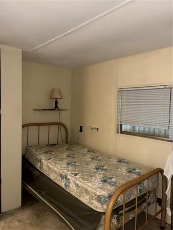 a bedroom with a bed and the table