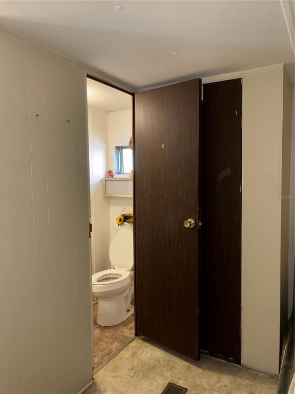 24533 Pink Panther Road Paisley, FL 32767 - Photo 21 of 29 a bathroom with a toilet and a shower