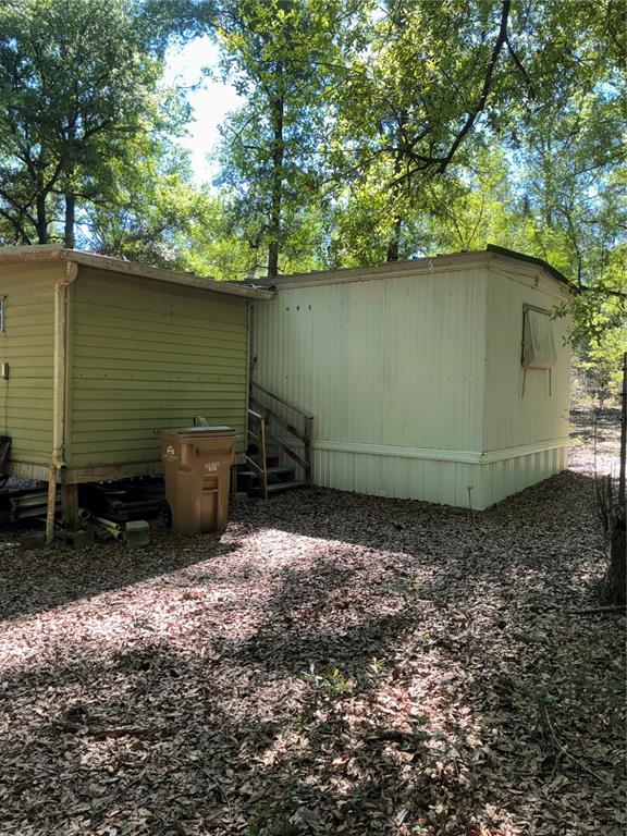 24533 Pink Panther Road Paisley, FL 32767 - Photo 24 of 29 a backyard of a house with outdoor seating