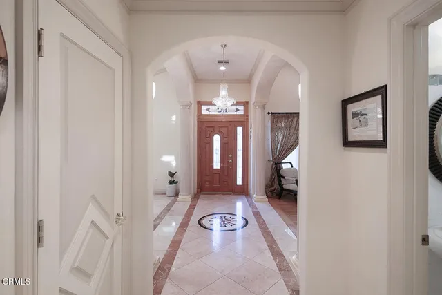 a kitchen with stainless steel appliances granite countertop a sink a stove and a wooden cabinets