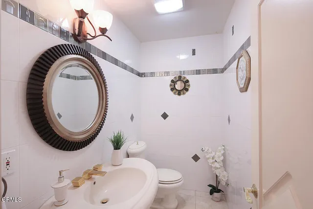 a living room with fireplace furniture and a floor to ceiling window