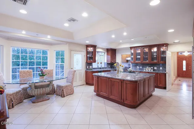 a stove top oven sitting inside of a kitchen