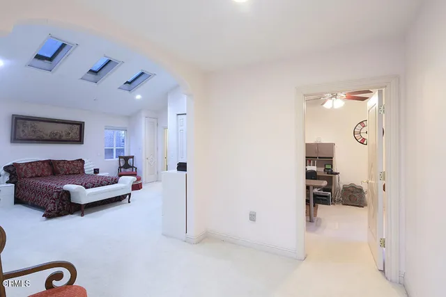 a bathroom with a granite countertop double vanity sinks and a mirror