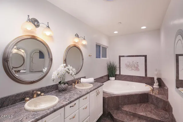 a spacious bedroom with a large bed and a window