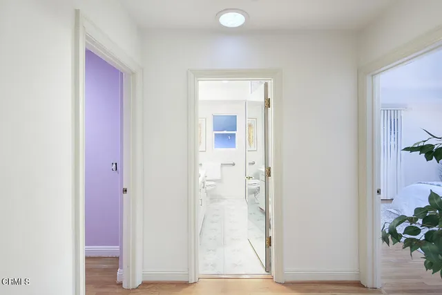 a wooden bench sitting in front of a building