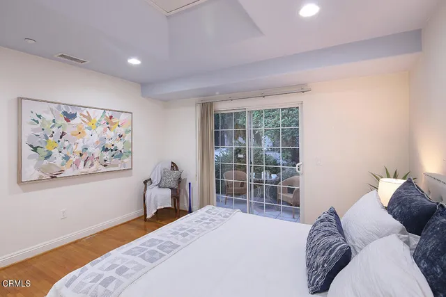 a garden with a bench and some trees