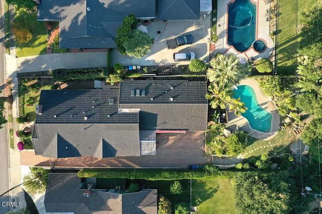 a kitchen with a sink cabinets and a stove top oven