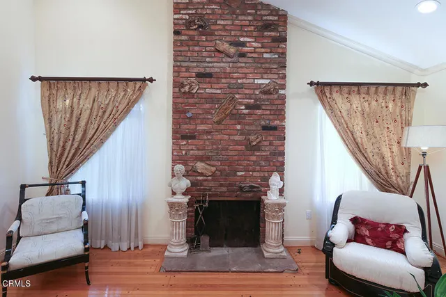 a view of living room with furniture and window