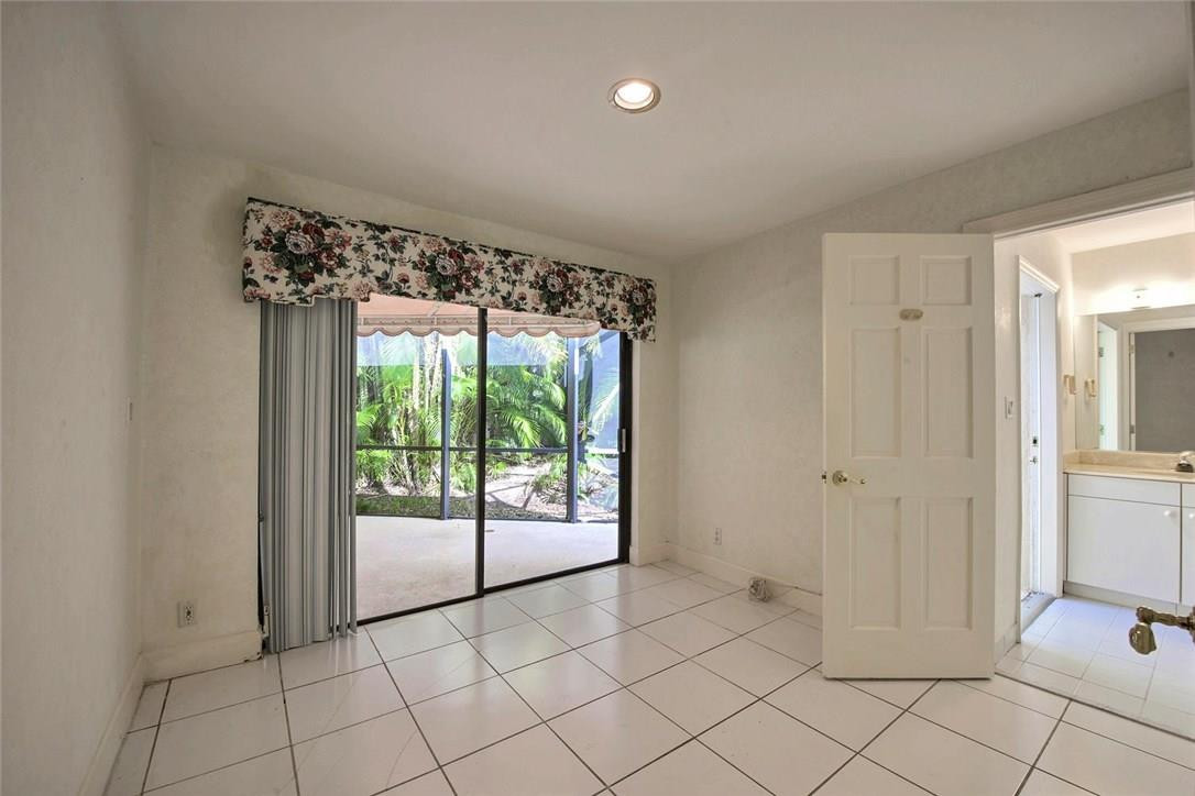 821 Northeast 77th Street Boca Raton, FL 33487 - Photo 27 of 31 a view of an empty room and window