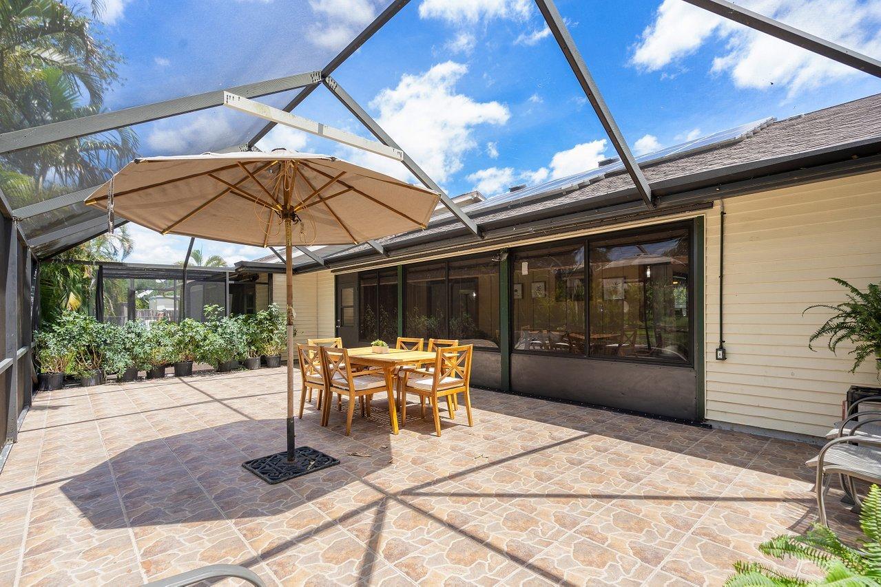 1369 Riverside Circle Wellington, FL 33414 - Photo 27 of 47 Screened patio
