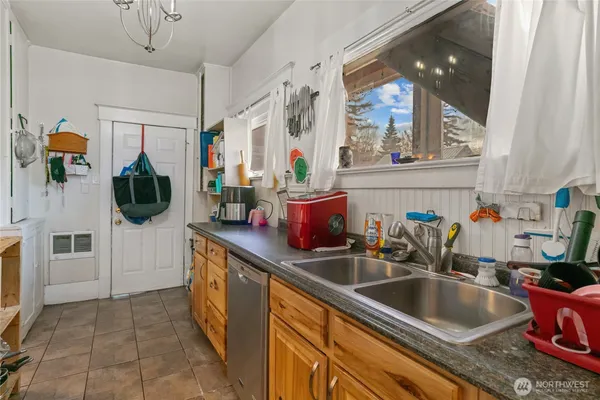 a kitchen with a sink and cabinets