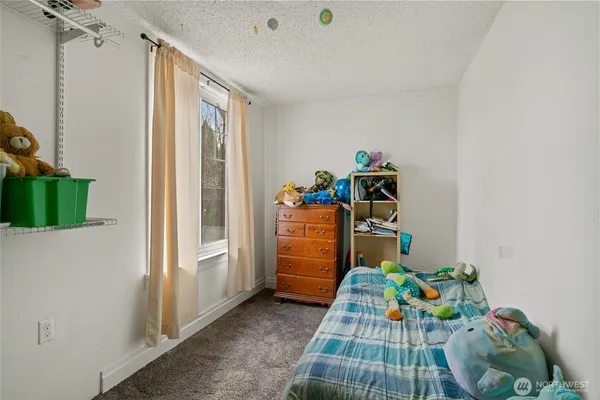 a kids room with toys and wooden floor