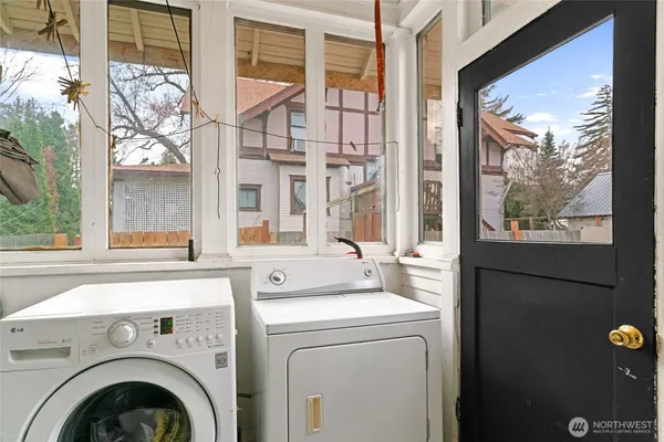 a view of washer and dryer next to a window
