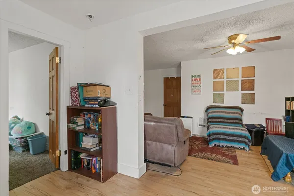 a bedroom with furniture and a window