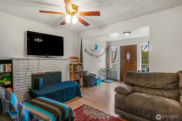 a living room with furniture fireplace and flat screen tv