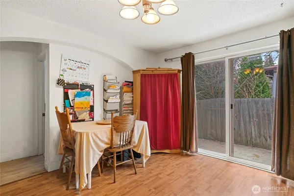 a view of a livingroom with furniture and wooden floor