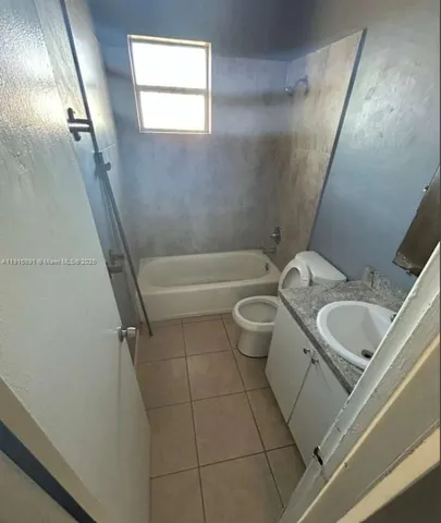 a bathroom with a sink and toilet